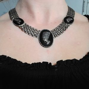 Chunky vintage silver toned necklace with cameos featuring artistic traditional